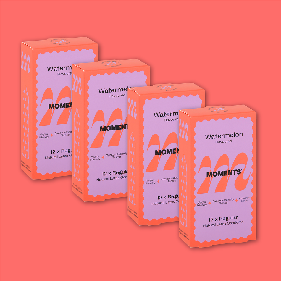 Moments Watermelon flavoured condom displayed on a pink surface