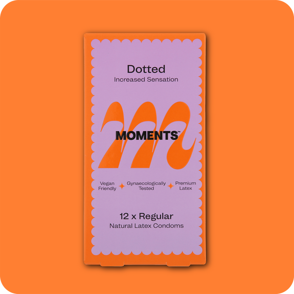 Moments Dotted condom pack in orange colour