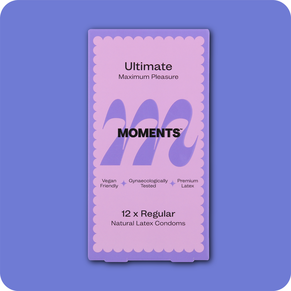 Close-up view of Moments Ultimate condom with its distinctive purple packaging